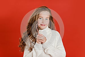 Merry Christmas girl in white sweater on bright red vivid color background