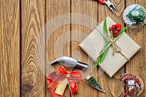 Merry Christmas Handy Tools Christmas Gift concept. Hammer, pliers, gift box and Christmas ornament decorations on wood