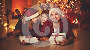 Merry Christmas! happy family mother father and child with magic