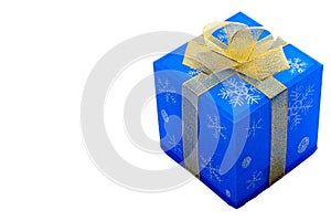 Merry Christmas and Happy holidays concept with a blue gift box with a gold bow, containing a present, isolated on white with a