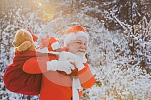 Merry Christmas and happy holidays. Delivery christmas gifts. Winter park trees covered with snow. Winter Christmas