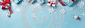 Merry Christmas and Happy Holidays greeting card, banner. Snowflakes and Christmas gifts on a blue background