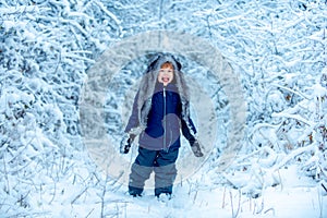 Merry Christmas and happy holidays. Winter child. Little child in snow field. Enjoying nature wintertime. Concept winter