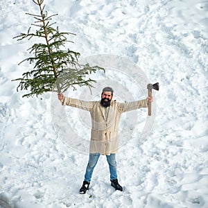 Merry Christmas and Happy Holidays. Winter emotion. Winter portrait of lumber in snow Garden cutting Christmas tree