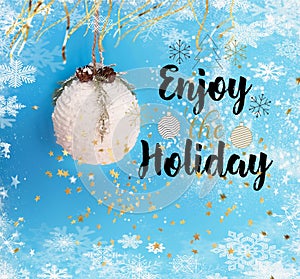 Merry Christmas and happy holidays wishes quotes  greeting card decoration white tree ball on blue background banner copy space