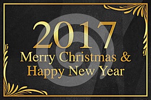 Merry Christmas and Happy New Year 2017 gold word on black wrinkled paper background