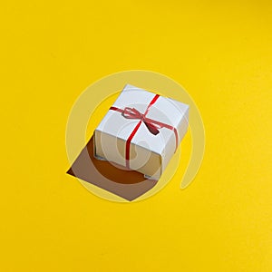 Merry Christmas and Happy new year 2019 Concept. Gift box on yellow background