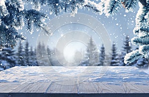 Merry Christmas and happy New Year background with table .Winter landscape with fir tree branch