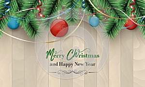 Merry Christmas and Happy New Year background with wooden pattern, baubles, green branches and colored ribbons.