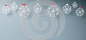 Merry Christmas and Happy New Year banner. Abstract white snowflakes on grey background. Paper art and craft design. Space for you