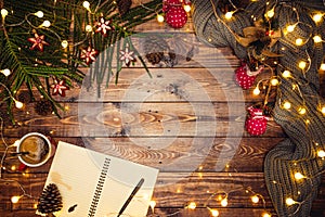 Merry Christmas and Happy New Year. Christmas composition. Gifts, fir tree branches, ball red decorations on a wooden background