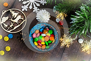 Merry Christmas and happy New year. Christmas decoration design on wooden background with candy bowl.the composition of Christmas