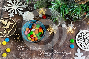 Merry Christmas and happy New year. Christmas decoration design on wooden background with candy bowl.the composition of Christmas