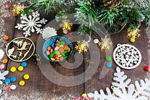 Merry Christmas and happy New year. Christmas decoration design on wooden background with candy bowl.the composition of Christmas