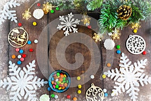 Merry Christmas and happy New year. Christmas decoration design on wooden background with candy bowl.the composition of Christmas