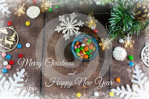 Merry Christmas and happy New year. Christmas decoration design on wooden background with candy bowl.the composition of Christmas