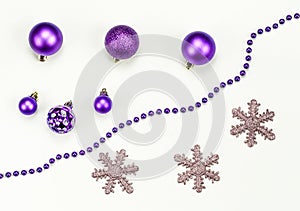 Merry Christmas and Happy New Year composition and decorations: Christmas toys, chaplet, snowflakes