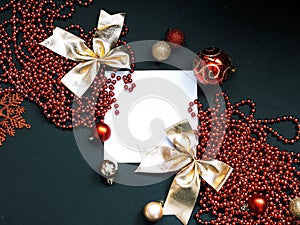Merry Christmas and Happy New Year Decoration. Red and gold Bauble on Christmas black background. Winter time. Snowflake
