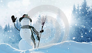 Merry Christmas and happy New Year greeting card with copy-space. Happy snowman with a broom in hand, standing in Christmas