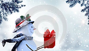 Merry Christmas and happy New Year greeting card with copy-space. Happy snowman with red gift box standing in Christmas