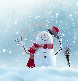 Merry christmas and happy new year greeting card with copy-space.Happy snowman standing in winter christmas landscape.Snow