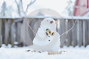 Merry Christmas and happy New Year greeting card with copy-space.Many snowmen standing in winter Christmas landscape.