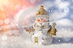 Merry Christmas and Happy New Year greeting card with copy space. Happy smiling snowman standing in sunny winter christmas