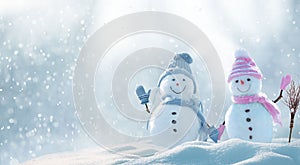 Merry Christmas and happy New Year greeting card with copy-space. Snow background. Winter fairytale. Two cheerful friends snowmen