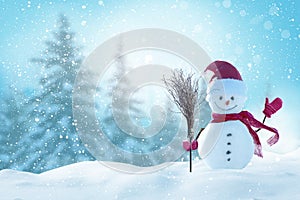 Christmas and happy new year greeting card with copy-space.Happy snowman standing in christmas landscape.Snow background.