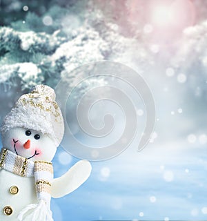 Merry christmas and happy new year greeting card. Happy snowman standing in winter christmas landscape.Snow background.