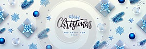 Merry Christmas and Happy New Year greeting card. Top view Christmas holiday background with fir tree, snowflakes, glass balls,