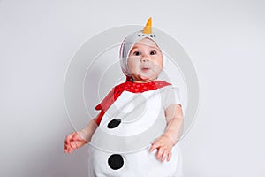 Merry Christmas and Happy New Year. Happy baby girl in snowman costume on white background