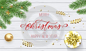 Merry Christmas and Happy New Year holiday golden decoration and calligraphy font for greeting card on white wooden background. Ve