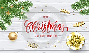Merry Christmas and Happy New Year holiday golden decoration and calligraphy font for greeting card on white wooden background. Ve