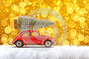 Merry Christmas and Happy New Year Postcard or Poster. Little classic red car carrying Christmas tree on its rack on the