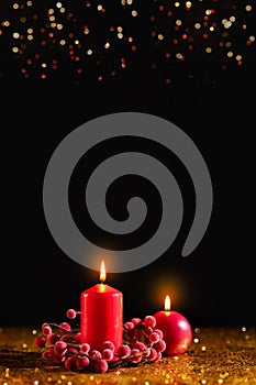 Merry Christmas and Happy New Year! Red candles on gold and black background