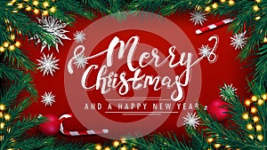 Merry Christmas and Happy New Year, red postcard with garland, frame of Christmas tree branches, red balls, candy cans