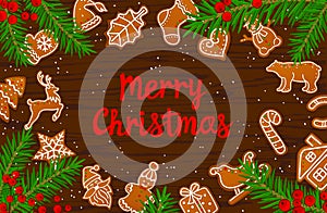 Merry Christmas and Happy New Year seasonal winter card background gingerbread cookies on wooden texture table