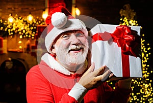 Merry Christmas. Happy new year. Smiling Santa Claus with present gift box. Winter family holidays.