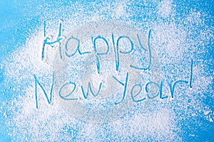 Merry Christmas and happy New year .Snow background with the inscription Happy new year. The view from the top.