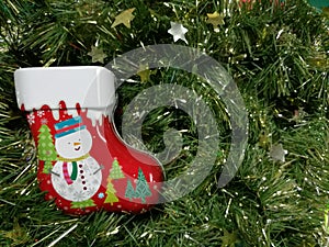 Merry Christmas and Happy New Year, snowman sock Tin Box with green tinsel