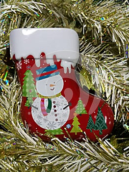 Merry Christmas and Happy New Year, snowman sock Tin Box with white and gold tinsel background