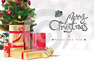 Merry Christmas and Happy New Year text with gift boxes and ornaments