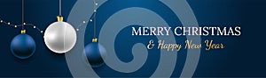 Merry Christmas and Happy New Year vector banner. Realistic rose gold and blue baubles, snowflakes hanging on dark blue background