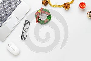 Merry Christmas and Happy new years office work space desktop concept. Flat lay top view with laptop and Christmas ornaments sign