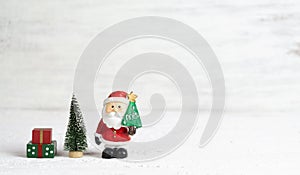 Merry Christmas and happy newyear background with copy space. Santa Claus, christmas tree, gift box with copy space for your text