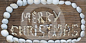 Merry Christmas inscription handmade with sea corals on wooden background.