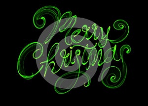 Merry Christmas isolated text written with flame fire light on black background. Green color