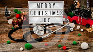 Merry Christmas light box with ornaments and stethoscope