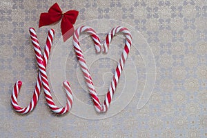 Merry Christmas Love symbol of hard stick candy and bow